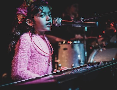 girl playing keyboards